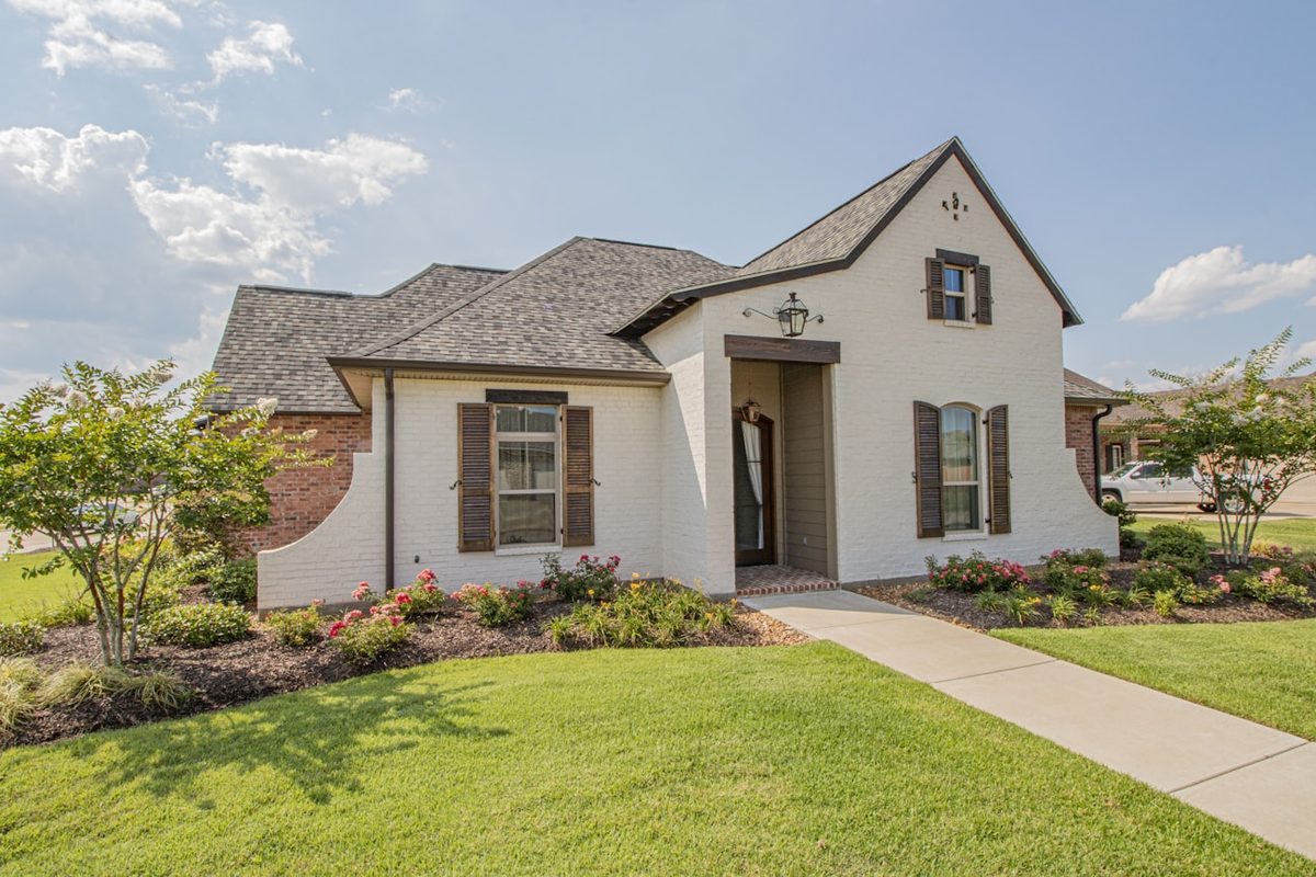 Established stucco-and-brick home with manicured landscaping in Beavercreek, Ohio