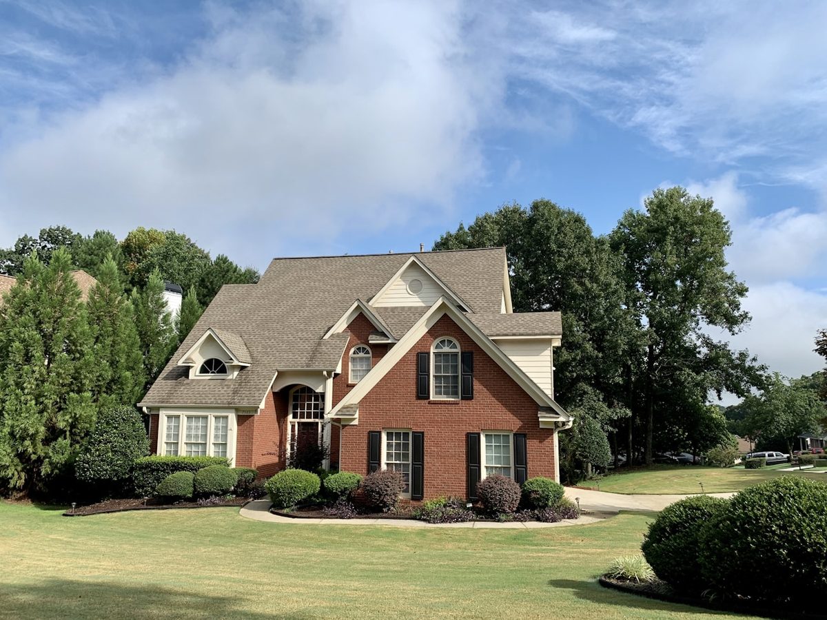 Classic red-brick colonial home with gabled rooflines in Centerville, Ohio